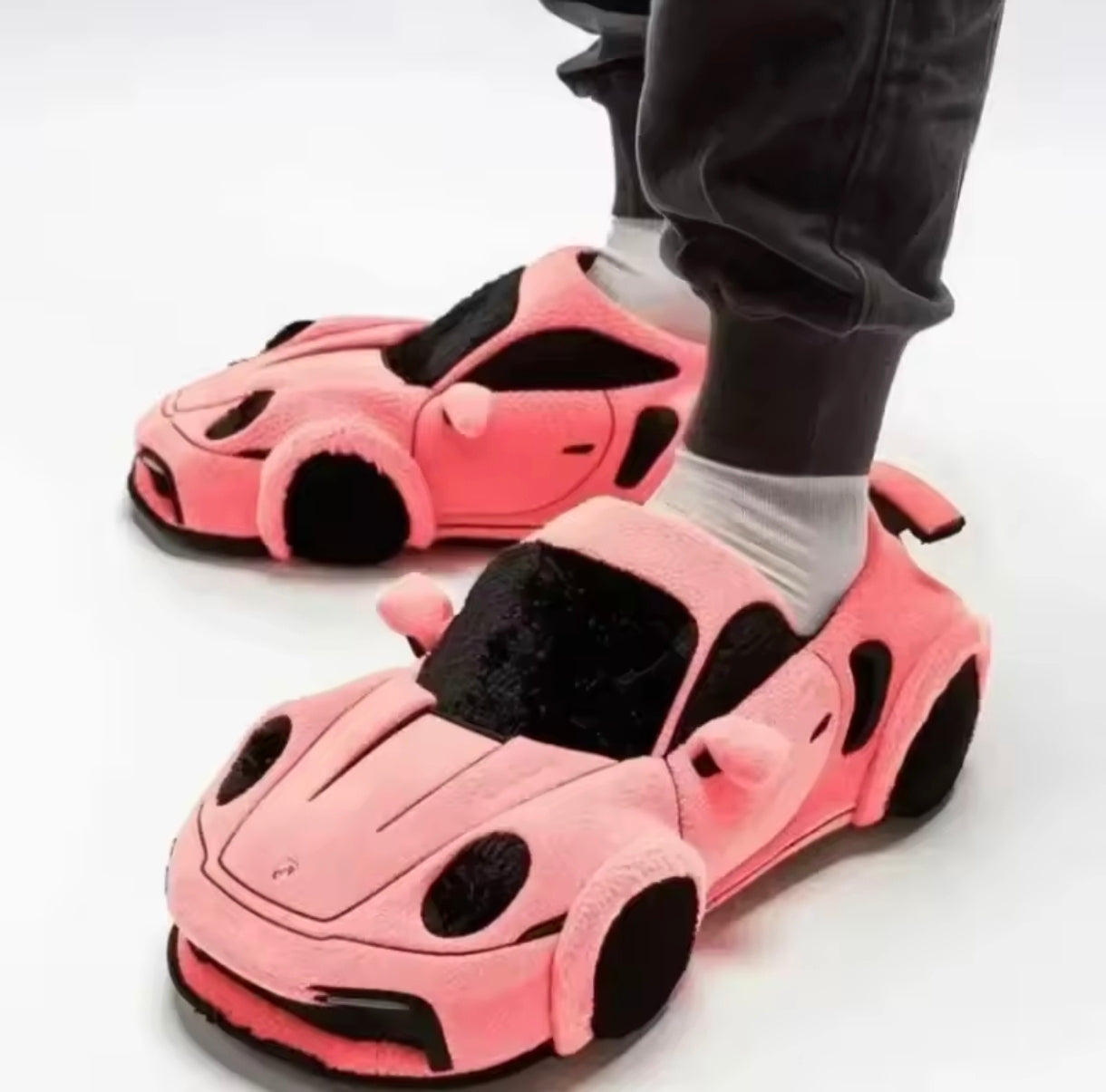 Plush slippers in the shape of a BMW and Porsche.