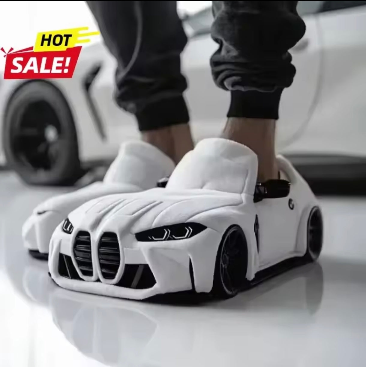 Plush slippers in the shape of a BMW and Porsche.