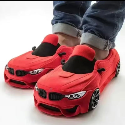 Plush slippers in the shape of a BMW and Porsche.